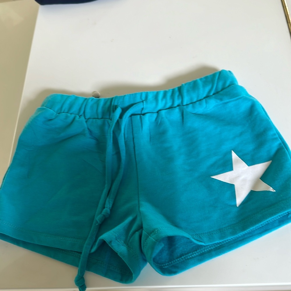 Girl’s turquoise Revelation shorts